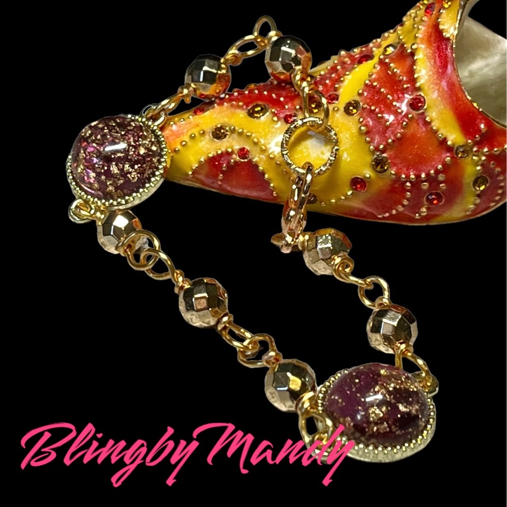 Pretty chain link bracelet, gold tones with purple and gold flecked charm links